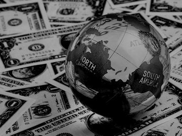 globe on top of American cash 