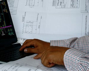 3D pressure vessel design on computer with plans and blueprint
