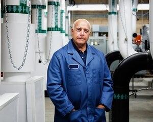 picture of a gentleman in front of HVAC equipment