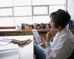 teacher planning at her desk