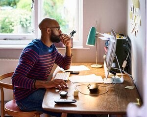 Man working at home on computer