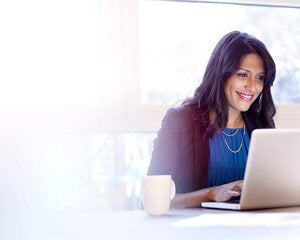 Young business woman working on a laptop