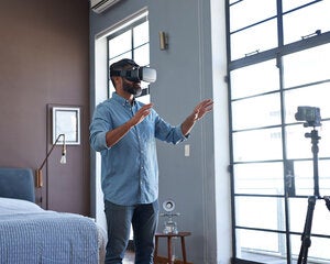 Man using a virtual reality headset in his apartment