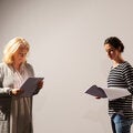 Two women reading their acting lines