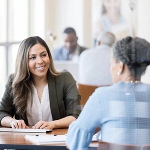 Financial planner assisting female client