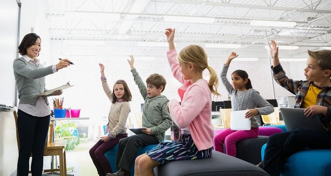 Teacher leading classroom of children