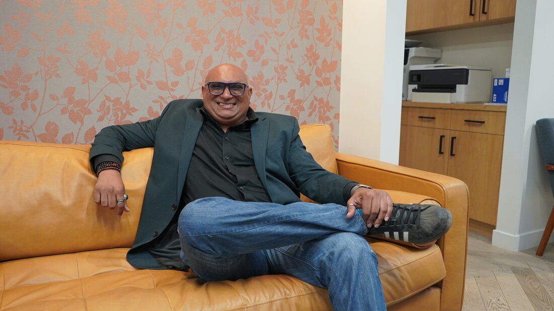 Ravi Pariah sitting on couch