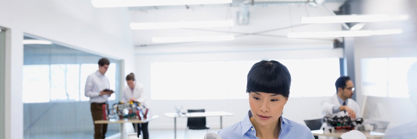 female engineer looking at plans