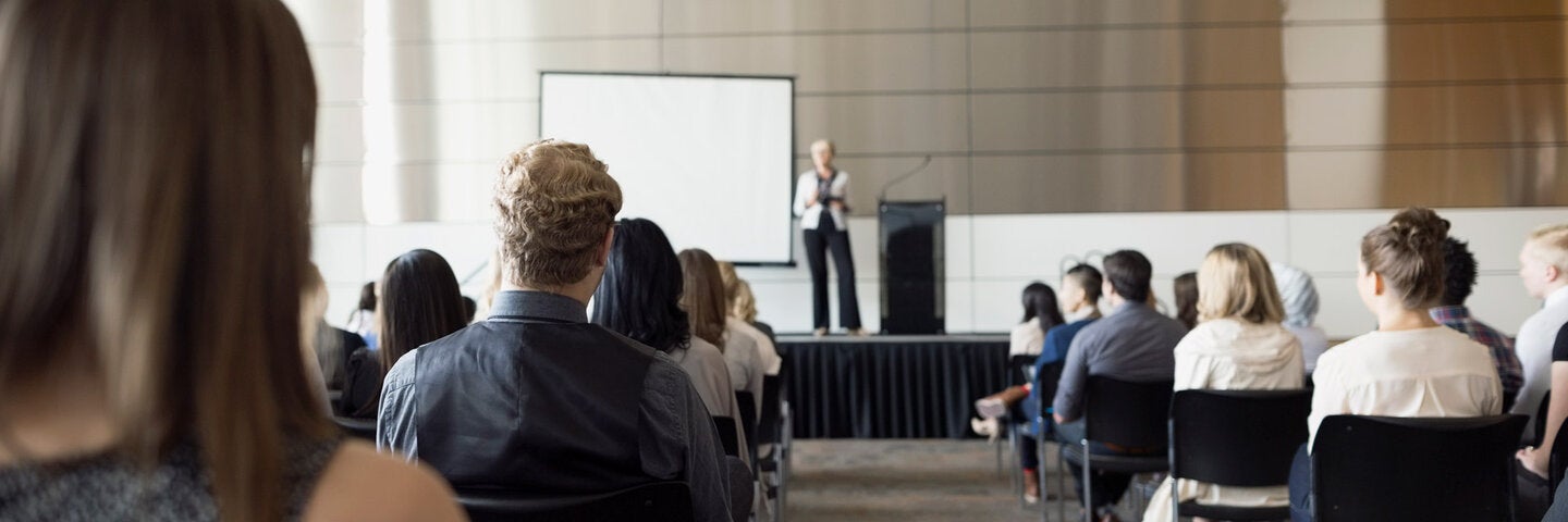 students sitting for a presentation