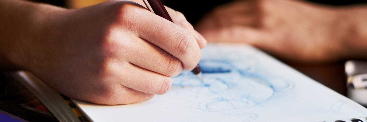Close up of an artist's sketch pad while they're drawing a design
