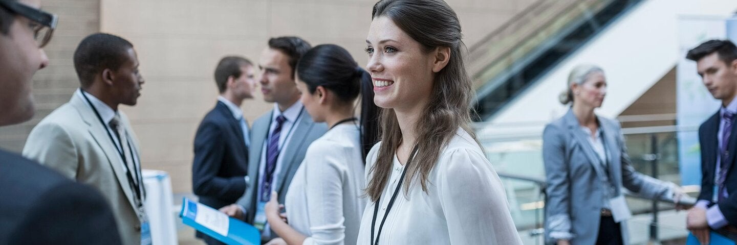Business people networking at conference