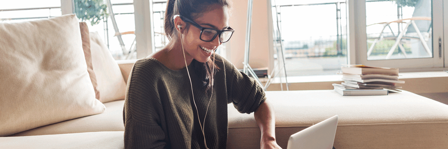 Woman writing on her laptop