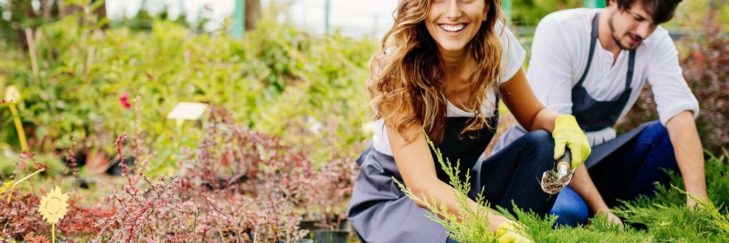 Young couple running a garden center.