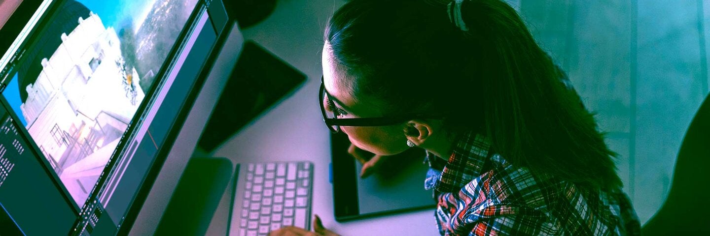 woman working on computer making video graphics