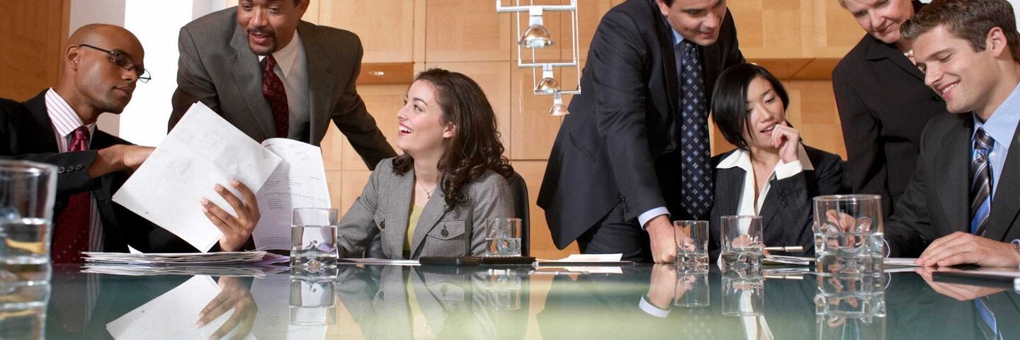 Group of business people conversing in conference room