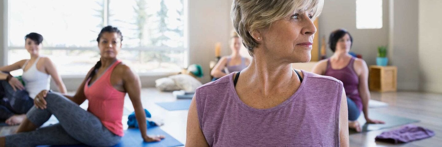 senior women in yoga class