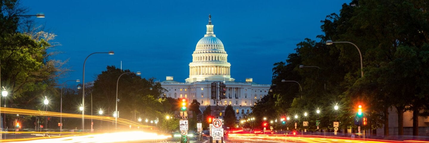 The United States Capitol building at night in Washington DC, USA.