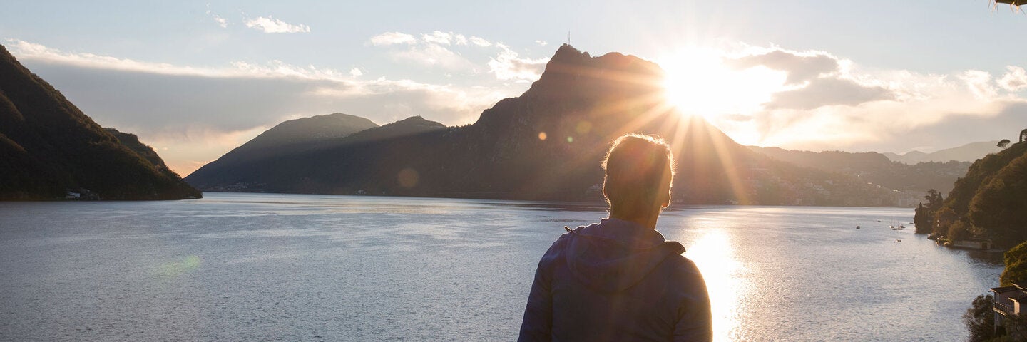 man standing at the lake's edge