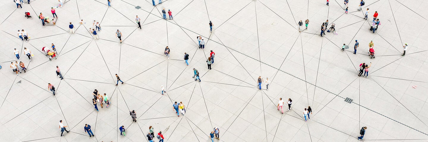 people dispersed across a matrix designed plaza