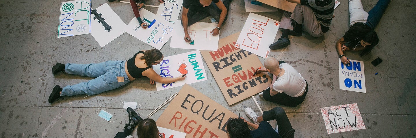 group creating signs for equal rights protest