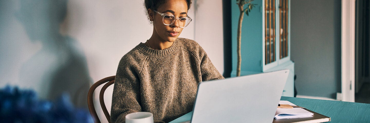 Woman writing at a desk