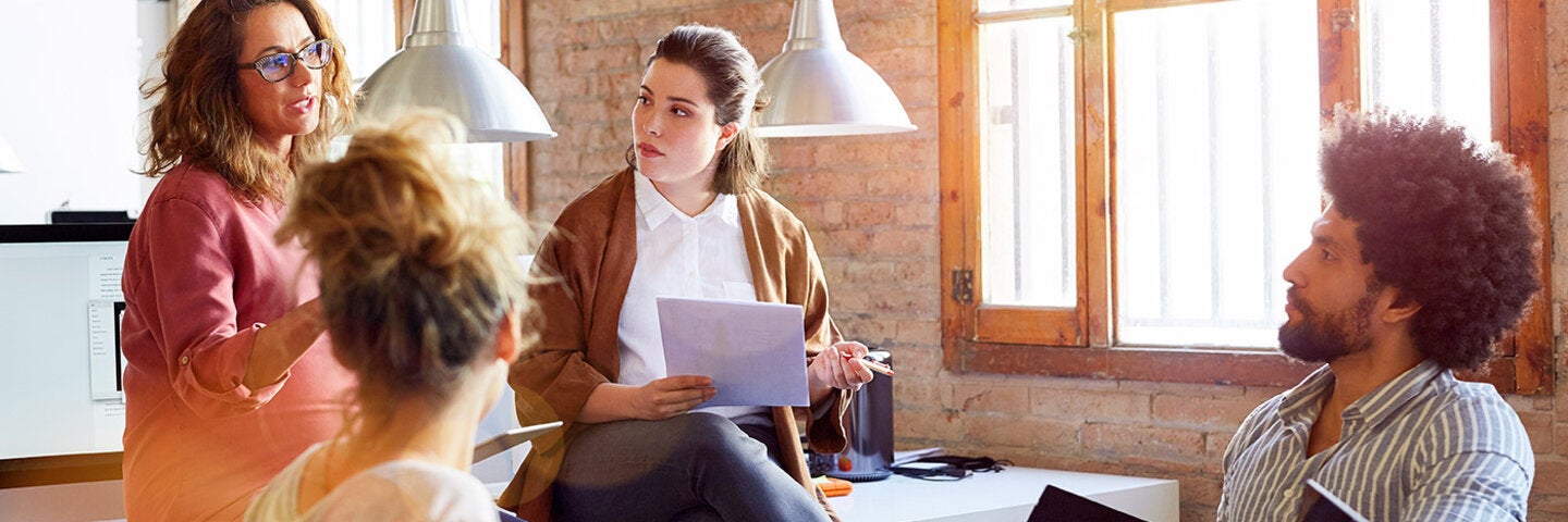 woman pitches her idea to the group