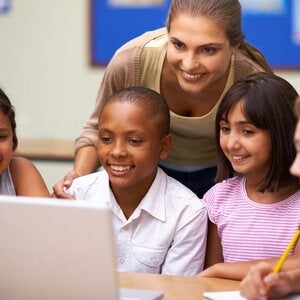 Young teacher with group of students