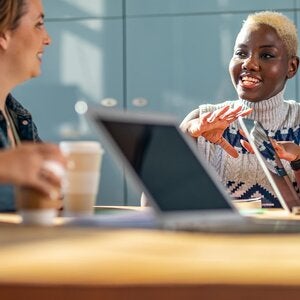 People at laptops around a table