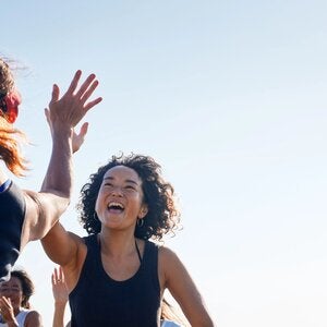 two women giving each other a high five