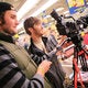 Two cinematographers using a camera